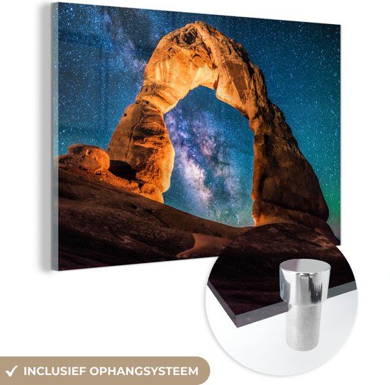 MuchoWow® Glass Painting 150x100 cm - Acrylic Glass Painting - A starry sky above an arch of rocks in Arches National Park - Photo on glass - Paintings