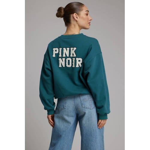 Pink Noir sweater met backprint turquoise