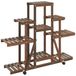 VidaXL Plantenstandaard met wielen 110x25x101 cm massief vurenhout