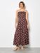 Apricot Jumpsuit met stippen en strik op de rug